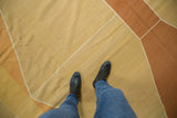 Modern contemporary Kilim flatweave with geometric diamond shapes in dusty gold and deep copper.