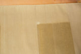 Hand woven back of the Kilim carpet, showing tight beige weave and intact side selvage.