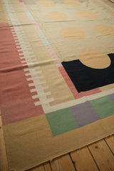 Vintage contemporary kilim corner with geometric madder red, pale green, and silver blocks.