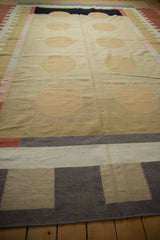 Hand woven contemporary Kilim carpet corner, geometric bands of charcoal, beige, ivory, and blush.