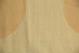 Detail of abstract tone-on-tone pattern on a Vintage Kilim rug in beige and sand.