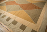 Modern geometric pattern on vintage Kilim in bronze, sand, and dark beige.