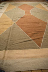 Modern Argyle-inspired diamond pattern on the vintage Kilim in bronze, dark beige, and dusty gold.