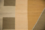 Modern Kilim geometric pattern detail in bronze, dusty gold, and dark beige-gray.