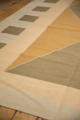 Detail of vintage contemporary kilim with modern argyle diamond pattern in bronze, sand, and gold.