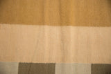 Modern contemporary Kilim carpet showing bronze, dusty ivory, and beige-gray color blocks.