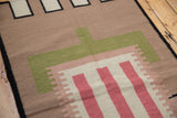 Stepped geometric pattern in beige, pale raspberry, and forest green on a contemporary Kilim runner.