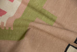 Hand woven Contemporary Kilim rug texture in pale raspberry, forest green, and beige.