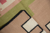 Corner detail of hand woven contemporary kilim, black side cord visible.