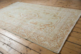 Vintage Bulgarian Kerman design carpet: Rococo outline, floral motifs, ivory fringe.