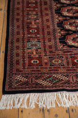Plush pile, white fringe, and charcoal side selvage of the vintage Bokhara rug.