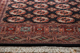 Vintage Bokhara rug border with intricate terracotta, black, ivory geometric patterns and fringes.