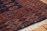 Lustrous wool pile and detailed geometric borders on a vintage Bokhara carpet with clean ivory fringe.