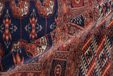 The plush, silk-like wool pile and high sheen of a vintage Pakistani Bokhara carpet.