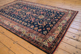 Rhythmic geometric border and playful diamond motifs on vintage Romanian Kuba carpet.