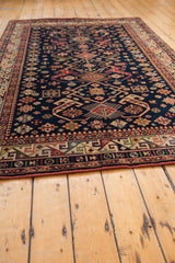 Rhythmic geometric main border and diamond patterns on vintage Romanian Kuba carpet.