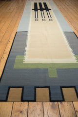 Full view of contemporary Kilim runner with abstract blocks in ivory, grey, blue, brown.
