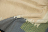 Abstract pattern and handwoven texture of a contemporary Kilim rug in beige, slate, green.