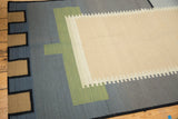 Abstract stepped border in brown, black, blue, and green on a contemporary Kilim runner.