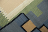Contemporary Kilim rug detail with staggered lines and interlocked border in blue, beige, green.
