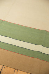 Hand-woven Contemporary Kilim rug with beige, mallard green, and madder root red abstract pattern.