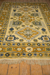 Vintage Siberian carpet fringe and saffron, gold, dark blue geometric floral border.
