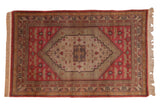 Vintage Chinese Khotan carpet, oversize diamond medallion, floral bouquet, brick red, ivory, 5' x 8'1