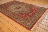 Full light beige fringe and dusty brick red border on this vintage Khotan rug.