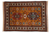 Vintage Siberian Kazak design carpet, double medallions, floral field in ochre, tangerine, and blue.