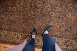 Vintage Romanian Tabriz carpet with a warm-toned field and navy, beige floral patterns.