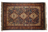 Vintage Indian Shiraz carpet, navy blue field with triple diamond medallions and folk art motifs.