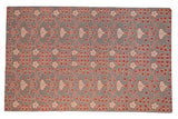 Samarkand design area rug with scrolling red and ivory florals on an oxidized silver field.