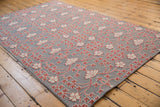 Angled view of the Samarkand carpet's mixed texture with raised floral pile.