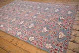 Angled corner view highlighting the mixed pile and flatweave Soumac texture of the Samarkand carpet.