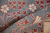 A rolled corner view showing the raised pile and flatweave texture of the Samarkand design carpet.