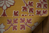 A folded corner reveals the unique reverse Soumac weave with raised hand-knotted pile.
