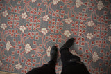 Close-up of the Samarkand carpet's mixed pile and flatweave texture in silver, ivory, and red.