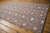 Angled view of the Samarkand carpet's scrolling floral pattern and unique mixed-pile weave.