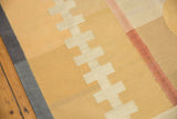 Contemporary Kilim carpet with dark grey side cord selvage and geometric ivory pattern.