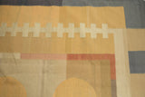 Geometric pattern detail of a Contemporary Kilim with banded rectangles in sand, blush, and blue.