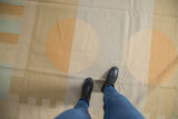 Hand woven Contemporary Kilim displaying abstract splayed circles and geometric shapes.