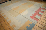 Vintage Contemporary Kilim rug's abstract geometric border detail with muted tones.
