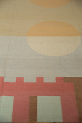 Abstract geometric motifs and a splayed circle on a Contemporary Kilim rug.