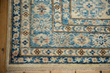 Detailed corner of a new Kazak rug with sapphire blue and ivory geometric motifs and intact selvage.