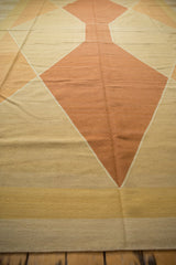 Alternating pale copper, gold, and sand diamond patterns on contemporary flatweave Kilim.