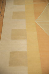 Intact side selvage and hand-woven texture of a geometric vintage Kilim rug.