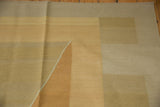 Contemporary Kilim detail: argyle diamond pattern, soft abrashes in beige, sand, and copper.