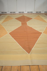 Dark copper and sand geometric diamond pattern on the vintage contemporary Kilim.