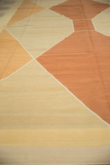 Flat woven texture of the contemporary Kilim, showing subtle sand and ivory bands.