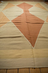 Modern hand woven Kilim detail: copper, beige-gray, and gold argyle-inspired diamond design.